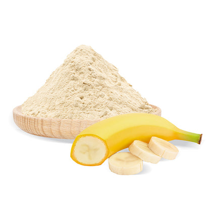 Banana powder in a wooden bowl with a banana and slices on a white background