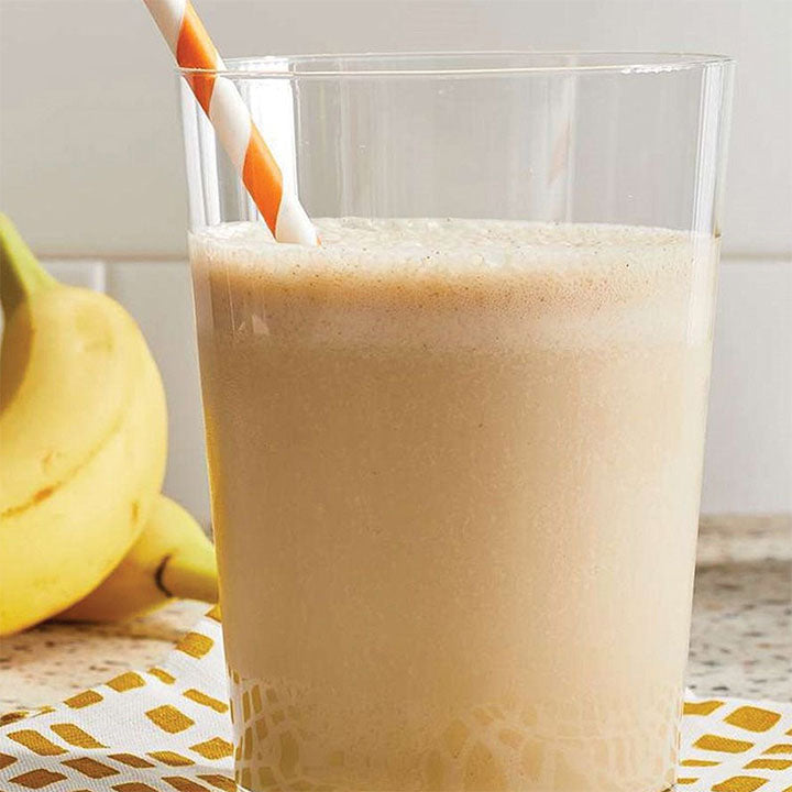 Banana smoothie on beverage shop background