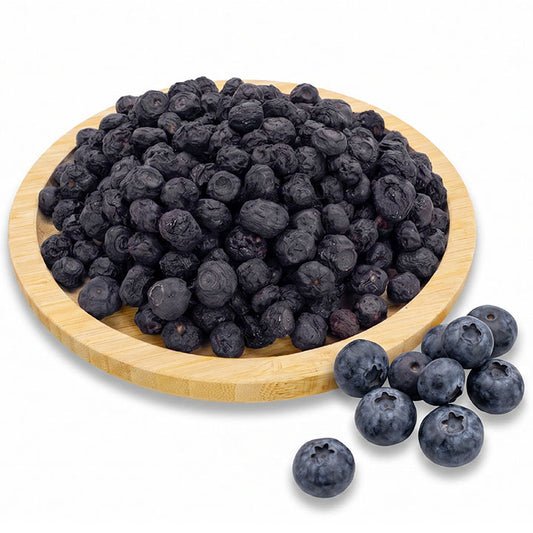 Dried blueberries in a wooden bowl on a white background