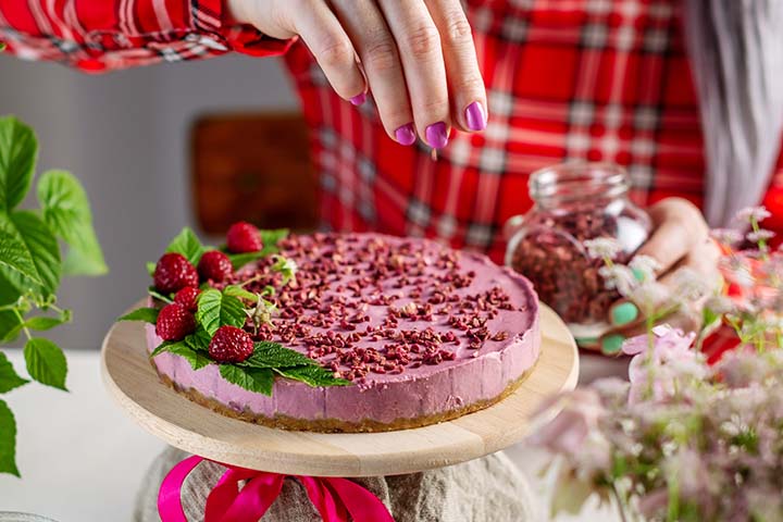 Professional bakers sprinkle freeze-dried fruit on delicious desserts