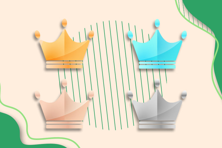 Four colorful paper crowns on a beige background with green accents
