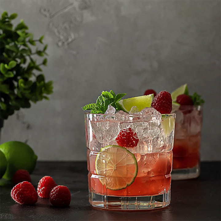 Raspberry cocktail on bar background