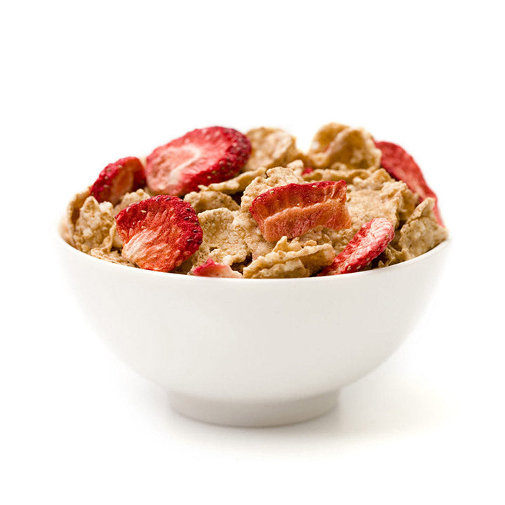 Bowl of cereal with strawberries on a white background