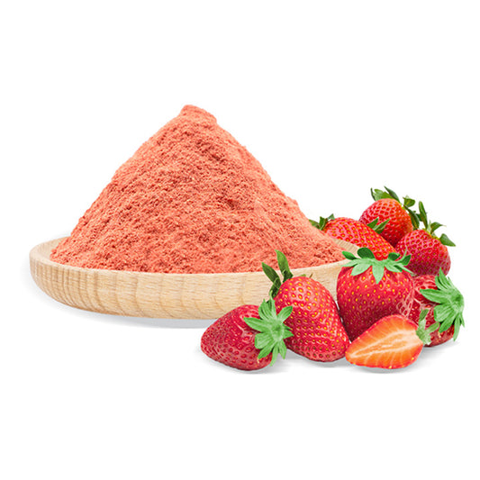 Strawberry powder in a wooden bowl with fresh strawberries on a white background